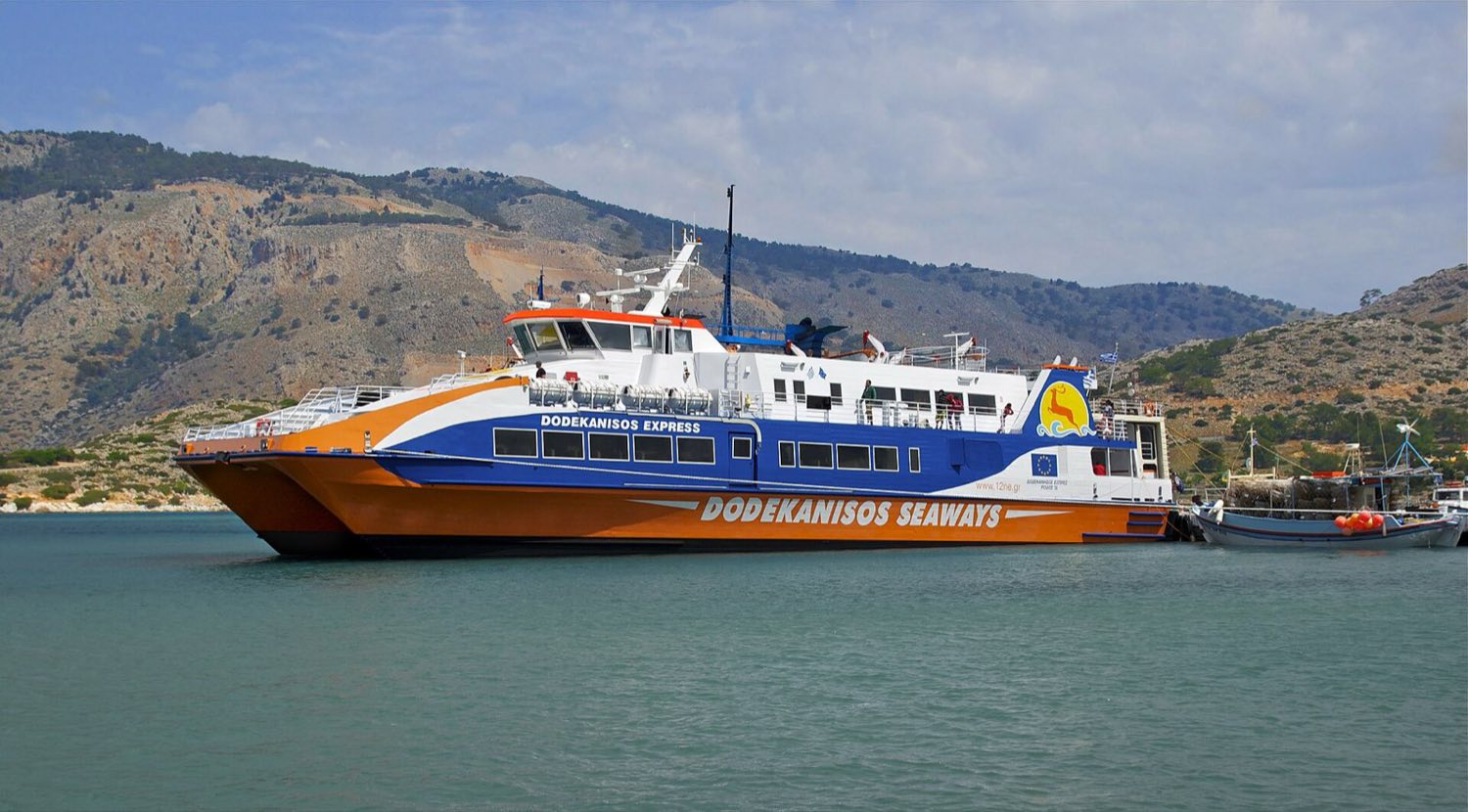 High-speed catamaran ferry alongside a quay in the Dodecanese, the fast option on routes from Kos