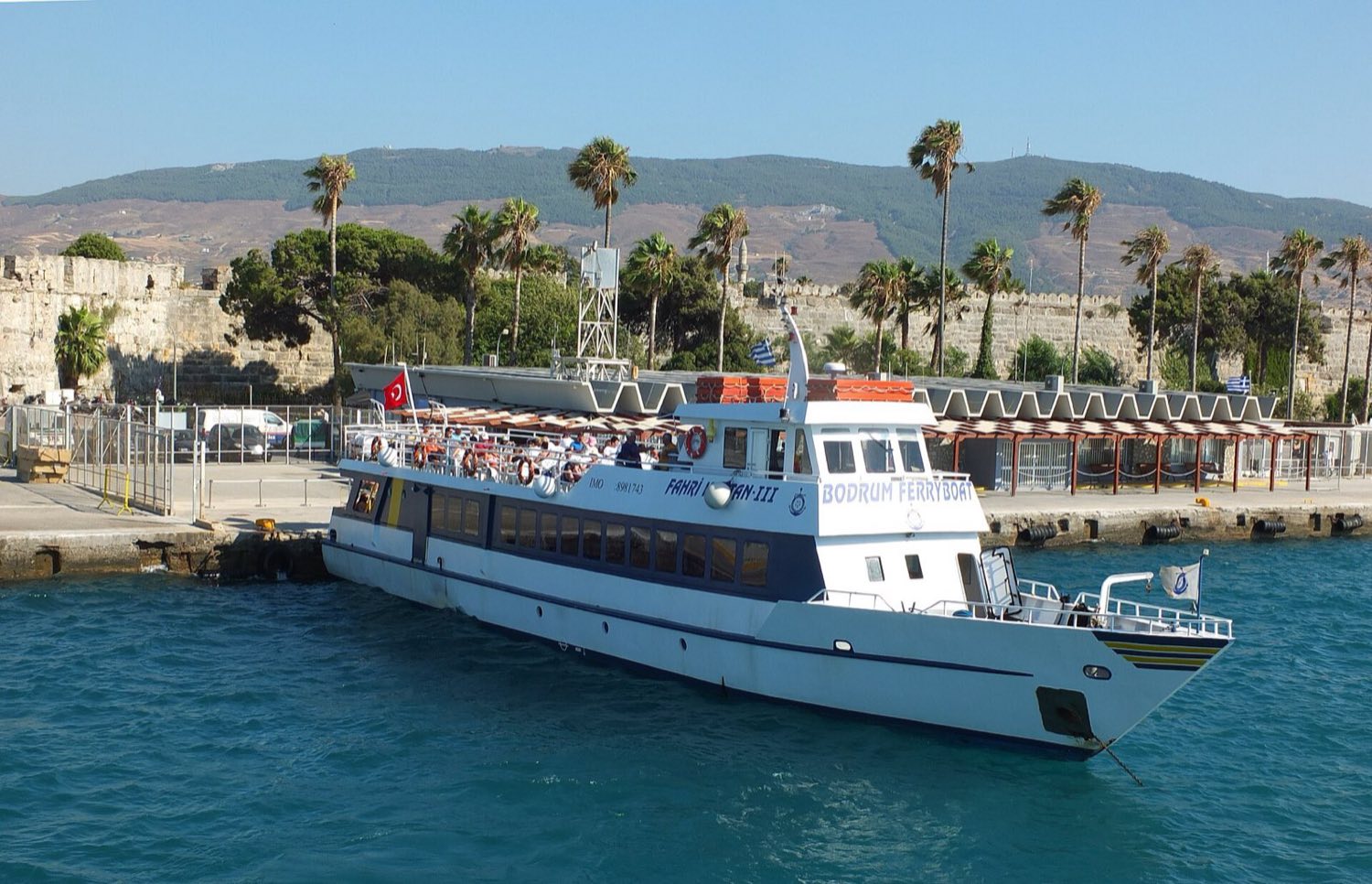 The Bodrum ferry moored at Kos harbour below the castle walls