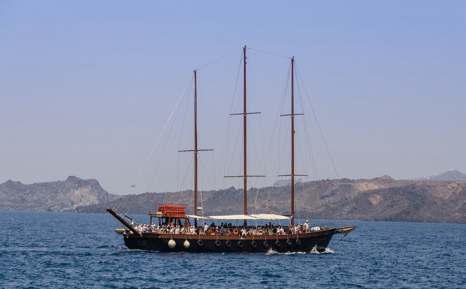 Galleon-styled pirate excursion boat with a stern waterslide moored on Kos
