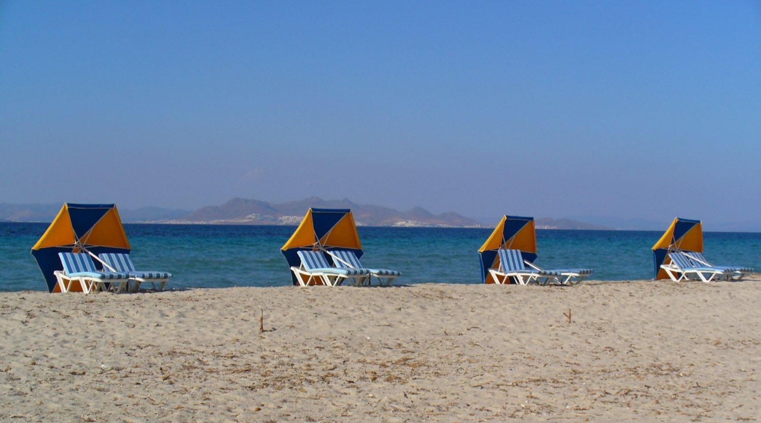 Long shallow sandy shoreline at Tigaki beach on the north coast of Kos